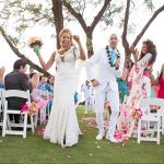 Bride & Groom dancing down the aisle with Sol Maui Event providing ceremony sound services